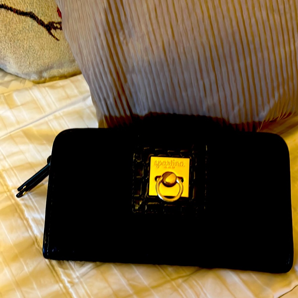Black with gold accents Spartina wallet. Beautiful condition.